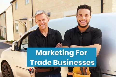 Tradesmen stood together infron of a van with writing in the front that says Marketing For Trade Businesses