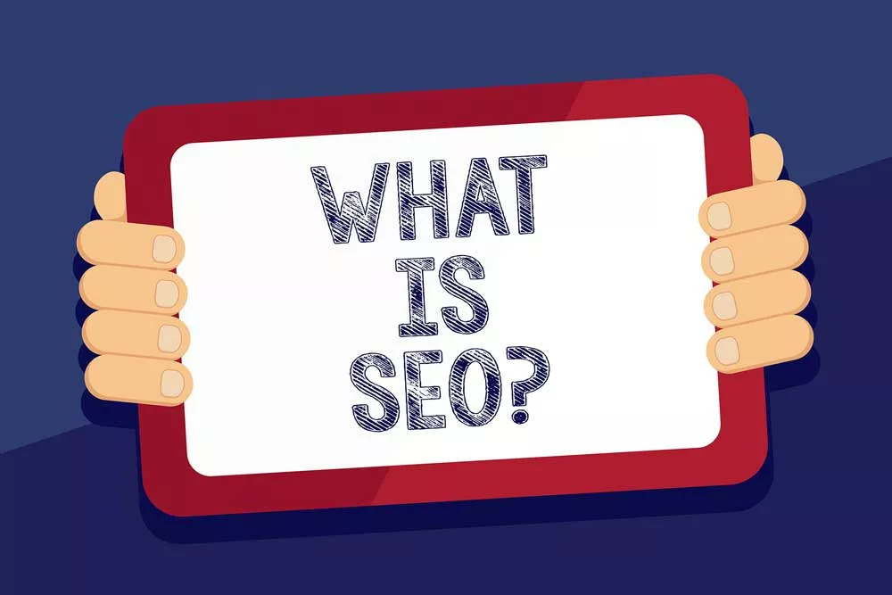 A drawing of hands holding a sign saying what is SEO