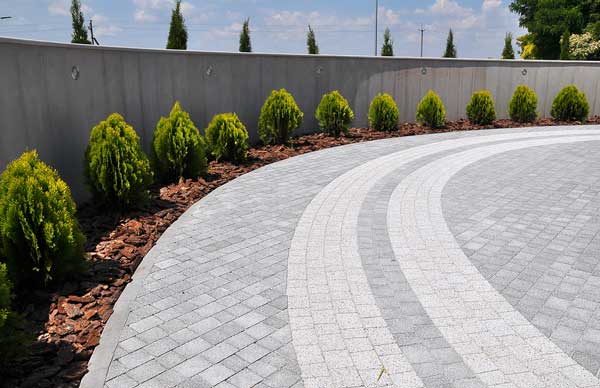 a newly laid driveway with grey brick