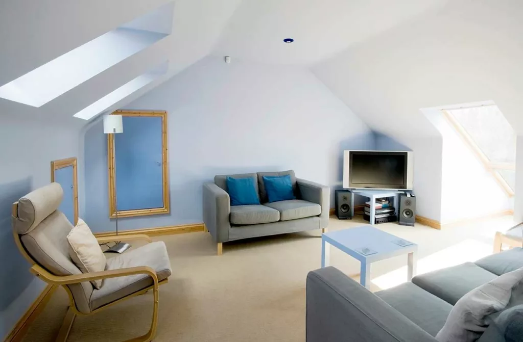 a finished loft conversion with grey furniture